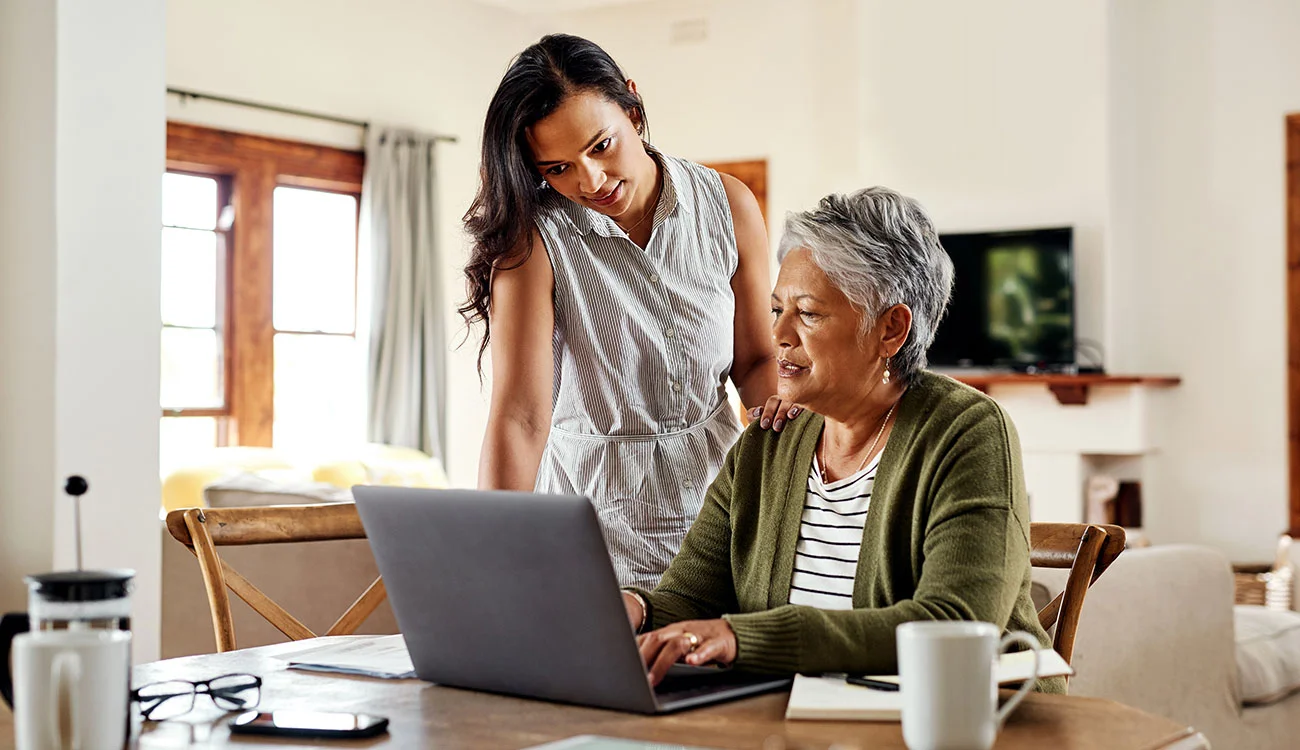 Two customers using online banking at home